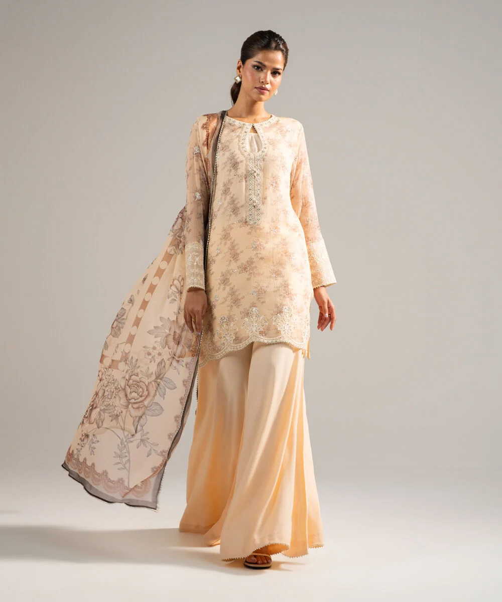 Peach embroidered Pakistani festive outfit with dupatta